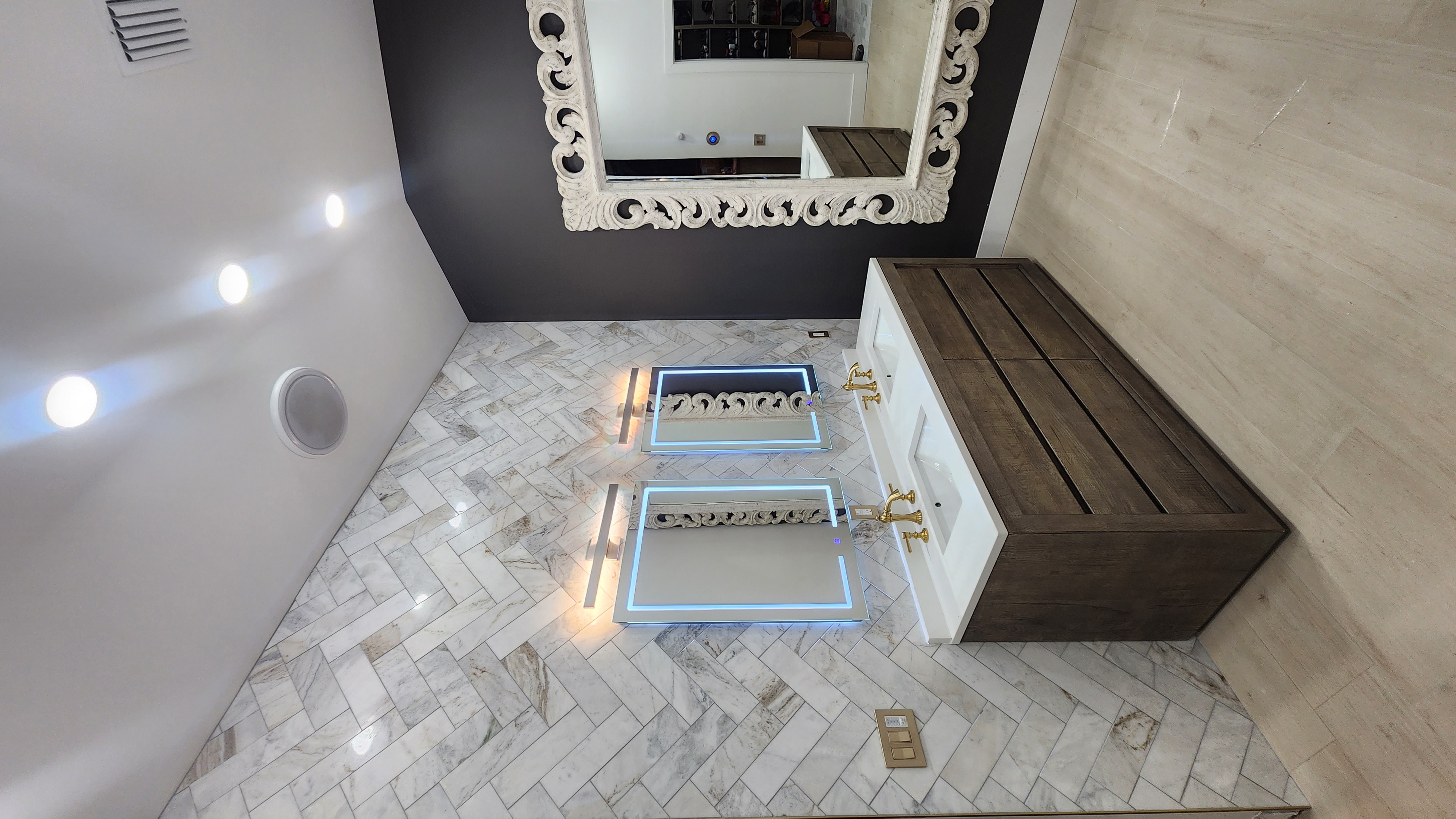 Bathroom with herringbone tile floor and custom vanity